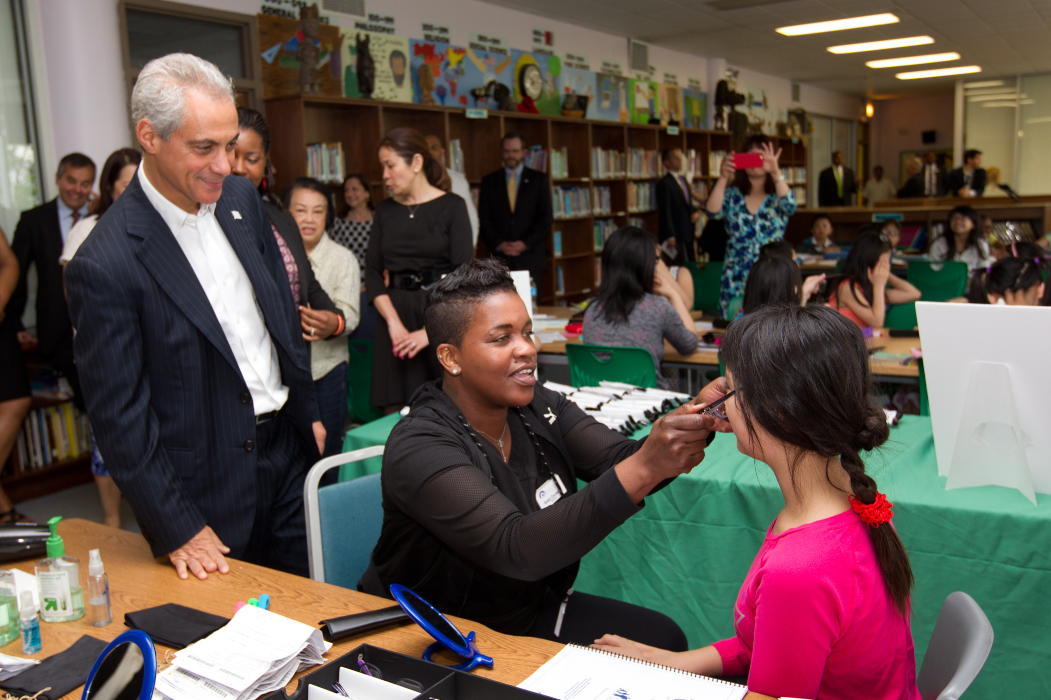 Mayor Emanuel visits with students receiving free eye glasses at Haines Elementary.